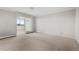 Bright living room features a sliding glass door for natural light and air at 3131 E Alameda Ave # 1203, Denver, CO 80209