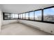 Bright, carpeted living space with expansive windows offering city views and natural light at 3131 E Alameda Ave # 1203, Denver, CO 80209