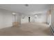 Bright living area showing entry to the kitchen with recessed lighting and carpet flooring at 3131 E Alameda Ave # 1203, Denver, CO 80209