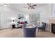 Cozy living room featuring a fireplace, comfortable seating, and sliding doors to the balcony at 8200 E 8Th Ave # 8101, Denver, CO 80230