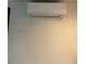 New air conditioning unit installed on the interior wall near the ceiling at 3101 W Jefferson Ave, Englewood, CO 80110