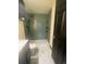 Bathroom featuring new shower, contemporary vanity and toilet over modern tile floor at 3101 W Jefferson Ave, Englewood, CO 80110