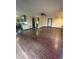 Open-concept living area featuring hardwood floors connecting the kitchen and living space at 3101 W Jefferson Ave, Englewood, CO 80110