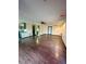 Open-concept space features hardwood floors, seamlessly integrating living and kitchen areas at 3101 W Jefferson Ave, Englewood, CO 80110