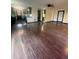 Inviting living room featuring hardwood floors, recessed lighting, and an open kitchen layout at 3101 W Jefferson Ave, Englewood, CO 80110