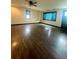 Spacious living room featuring polished hardwood floors and abundant natural light at 3101 W Jefferson Ave, Englewood, CO 80110