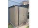 New metal storage shed installed to the side of the residence on a concrete slab at 3101 W Jefferson Ave, Englewood, CO 80110