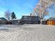 Large backyard with snow-covered ground and a deck at 928 S Ventura St, Aurora, CO 80017