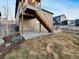 Backyard view featuring a wooden deck staircase and partial lawn area at 4877 Cattle Cross Rd, Castle Rock, CO 80104