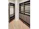 Organized walk-in closet with custom shelving and drawers for ample storage at 4877 Cattle Cross Rd, Castle Rock, CO 80104