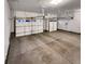 Spacious two-car garage with concrete flooring and white garage doors at 4877 Cattle Cross Rd, Castle Rock, CO 80104