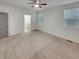 Spacious main bedroom with neutral carpet, ceiling fan, and plenty of natural light at 4877 Cattle Cross Rd, Castle Rock, CO 80104