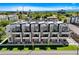Aerial view showcasing modern townhomes with rooftop decks in a vibrant urban setting at 3308 W 17Th Ave, Denver, CO 80204