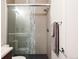 Stylish bathroom featuring glass shower, updated fixtures, and tiled accents at 3308 W 17Th Ave, Denver, CO 80204