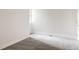 Bright bedroom featuring neutral walls, cozy gray carpet, and modern minimalist trim at 3308 W 17Th Ave, Denver, CO 80204