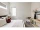Bright bedroom featuring neutral walls, plush bedding, and a cozy sitting area with stylish decor for a relaxing ambiance at 3308 W 17Th Ave, Denver, CO 80204