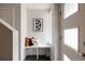 Bright entryway features modern decor, including a bench, sleek artwork, and a stylish door at 3308 W 17Th Ave, Denver, CO 80204