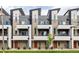 Modern townhome exterior featuring gray siding, brick accents, balconies, and vibrant orange front doors at 3308 W 17Th Ave, Denver, CO 80204