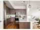 Well-equipped kitchen featuring stainless steel appliances, center island, and modern fixtures at 3308 W 17Th Ave, Denver, CO 80204