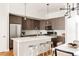 Contemporary kitchen with stainless steel appliances, a large island, and stylish pendant lighting at 3308 W 17Th Ave, Denver, CO 80204