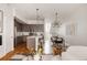 Open concept living space includes the living room, kitchen, and dining room with hardwood floors throughout at 3308 W 17Th Ave, Denver, CO 80204