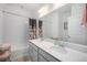 Bathroom boasts dual sinks, shower-tub combo, and great lighting, nice neutral tones and great finishes at 7877 Yampa River Ave, Littleton, CO 80125