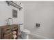 Charming half bath with wood-look floors and rustic decor creates a warm and inviting space at 7877 Yampa River Ave, Littleton, CO 80125