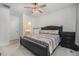 Spacious bedroom with ceiling fan, nice natural light, and neutral carpets at 7877 Yampa River Ave, Littleton, CO 80125