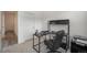 Bright home office with black desk and chair set and good natural light. Features included storage at 7877 Yampa River Ave, Littleton, CO 80125
