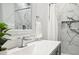Modern bathroom featuring a white quartz countertop, beautiful backsplash and shower with a glass door at 8020 E 136Th Dr, Thornton, CO 80602