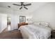 Clean bedroom with plush carpet, a dresser with a mirror, and view to the rest of the home at 8020 E 136Th Dr, Thornton, CO 80602