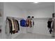 Spacious walk-in closet with ample storage space and neutral carpeting at 8020 E 136Th Dr, Thornton, CO 80602