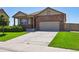 Charming single-Gathering home with a well-manicured lawn and inviting front entrance, plus a two car garage at 8020 E 136Th Dr, Thornton, CO 80602