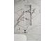 Shower featuring sleek marble-style tiles and a built-in shampoo nook at 8020 E 136Th Dr, Thornton, CO 80602