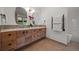 Modern bathroom features double vanities, wood cabinetry, and a heated towel rack for added comfort at 365 Bow Mountain Rd, Boulder, CO 80302