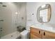 Modern bathroom with a walk-in shower, sleek fixtures, and a minimalist vanity with wood accents at 365 Bow Mountain Rd, Boulder, CO 80302