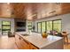 Spacious kitchen features large island, stainless steel appliances, and seamless flow to dining and living areas at 365 Bow Mountain Rd, Boulder, CO 80302