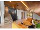Bright modern living room with stairs, beautiful wood ceilings, and comfortable seating adjacent to mountain views at 365 Bow Mountain Rd, Boulder, CO 80302