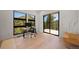 Bright office with large windows offering views and an adjacent balcony to enjoy the outside at 365 Bow Mountain Rd, Boulder, CO 80302