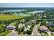 Neighborhood aerial view showcasing lush landscaping, mature trees, and nearby lakes at 5722 S Benton Way, Littleton, CO 80123