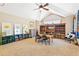 Spacious bedroom with vaulted ceilings, ceiling fan, and well-lit bookcase at 5722 S Benton Way, Littleton, CO 80123