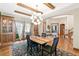 Dining room featuring a beamed ceiling, hardwood floors, and built-in cabinets at 5722 S Benton Way, Littleton, CO 80123