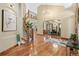 Stunning entryway with curved staircase, hardwood floors, and high ceilings, flowing into the dining area at 5722 S Benton Way, Littleton, CO 80123