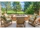 Outdoor fire pit with surrounding seating, perfect for relaxing and entertaining guests at 5722 S Benton Way, Littleton, CO 80123