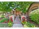 Charming home exterior featuring stone accents, manicured landscaping, and a welcoming entrance at 5722 S Benton Way, Littleton, CO 80123