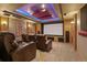 Stunning home theater with a large screen, theater seating, and custom lighting at 5722 S Benton Way, Littleton, CO 80123