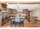 Gourmet kitchen featuring custom cabinets, stainless steel appliances, and a large island at 5722 S Benton Way, Littleton, CO 80123