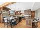 Gourmet kitchen with stainless steel appliances, a large island, and custom cabinetry at 5722 S Benton Way, Littleton, CO 80123