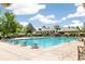 Community lap pool with deck and lounge chairs at 5722 S Benton Way, Littleton, CO 80123