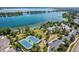 Aerial view of community tennis courts with lake access and clubhouse at 5722 S Benton Way, Littleton, CO 80123